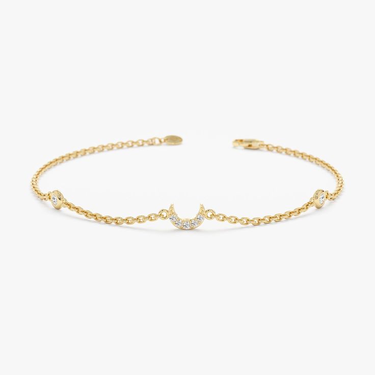 Embrace the enchanting beauty of the crescent moon with this captivating Diamond Crescent Moon Bracelet. Crafted in 14k gold (available in yellow, rose, or white), this delicate bracelet features a single crescent moon charm adorned with two sparkling natural diamond bezels. The minimalist design and captivating gemstones offer a timeless and elegant look. - Handmade - Solid Gold - Natural Diamond  - G Color, SI Quality Diamonds - Total Diamond Carat Weight: 0.09 ctw - Dimensions of the Moon: 4 Elegant Moon Charm Bracelet, Elegant Gold Bracelets With Moon Phase, Elegant Gold Moon Phase Bracelets, Elegant Moon Phase Bracelets, Elegant Moon Phase Bracelet, Elegant Moon Phase Bracelet As A Gift, Elegant Adjustable Crescent Bracelet, Elegant Moon Phase Bracelet As Gift, Elegant Moon Phase Bracelet For Gift