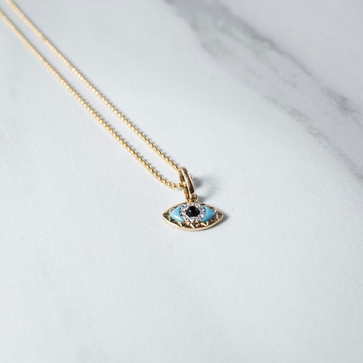 A charmed beauty - the Evil Eye has so many powerful meaning, especially our intricate charmed chain, a sure show stopper and a piece to last a lifetime. - Charm: 12mm Solid 14kt Gold Charm adorned with pave' diamond's, natural turquoise and obsidian stone. - Chain: 14/20 Gold Filled Talismans created to protect against the evil eye are also frequently called "evil eyes". Amulet Style 14k Gold Jewelry With Charms, 14k Gold Tarnish Resistant Amulet Jewelry, Tarnish Resistant 14k Gold Amulet Jewelry, 14k Gold Tarnish-resistant Amulet Jewelry, Yellow Gold Pendant Jewelry With Diamond Eyes, Gold Plated Gemstone Amulet Jewelry, Luxury Pendant Jewelry With Diamond Eyes, Yellow Gold Round Pendant Jewelry With Diamond Eyes, Luxury Diamond Eyes Pendant Jewelry