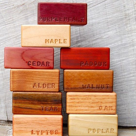 several wooden blocks with words on them stacked up in the shape of a pyramid that says maple, cedar, alder, walnut and teak