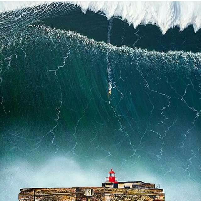 a painting of a man riding a surfboard on top of a wave in the ocean