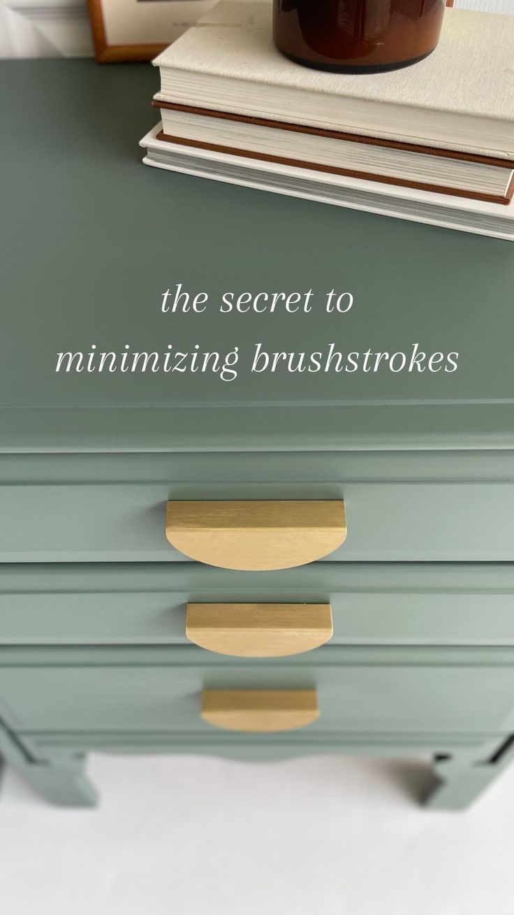 the secret to minimizing brush strokes is on top of a green dresser with gold handles