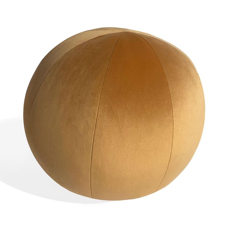 a large brown ball sitting on top of a white floor