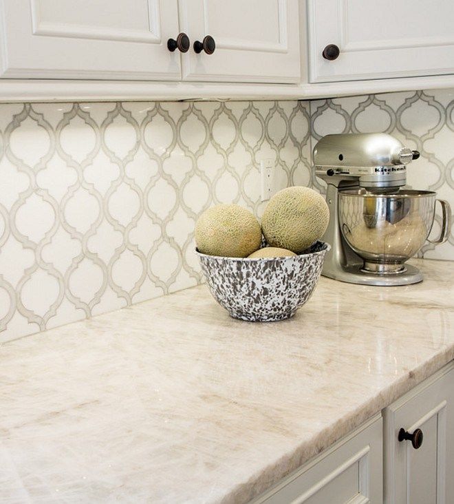 two sponges are in a bowl on the kitchen counter