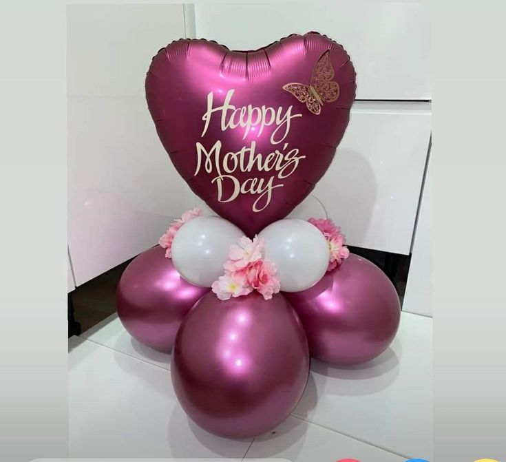 the balloon is shaped like a heart and says happy mother's day