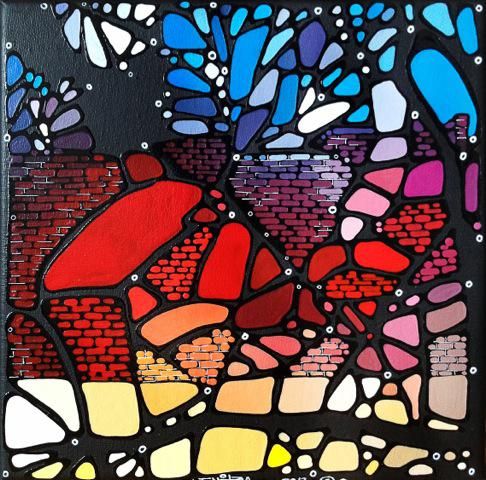 a piece of art that is made out of stained glass and has many different colors