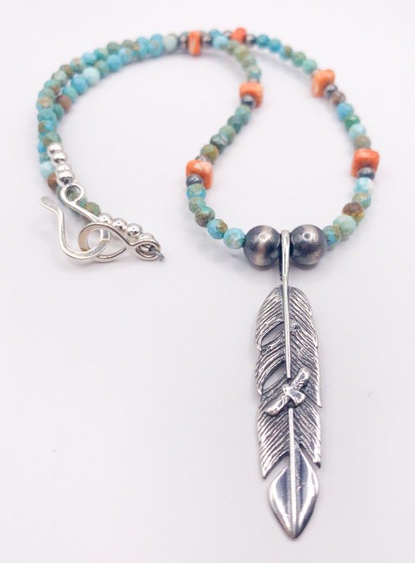 Earthy, boho - Southwestern style hand-strung necklace. This PCJ designed necklace consists of light green faceted round 4mm turquoise beads, 4mm orange spiny oyster square beads and Navajo Pearls (8mm and 4mm) and 2.25" long sterling silver feather pendant with a silver hook & eye clasp. The pendant has a small flying bird design in the middle of the feather. Necklace measures 17" length. Pairs perfectly with the Presidio Earrings!! - Sterling silver - Genuine turquoise and spiny oyster - 1 Adjustable Southwestern Turquoise Pendant Necklace, Adjustable Southwestern Silver Turquoise Necklace, Southwestern Single Strand Jewelry Gift, Southwestern Single Strand Sterling Silver Jewelry, Southwestern Single Strand Jewelry For Gifts, Southwestern Sterling Silver Beaded Jewelry, Adjustable Artisan Beaded Sterling Silver Necklace, Adjustable Artisan Sterling Silver Beaded Necklace, Artisan Sterling Silver Adjustable Beaded Necklace