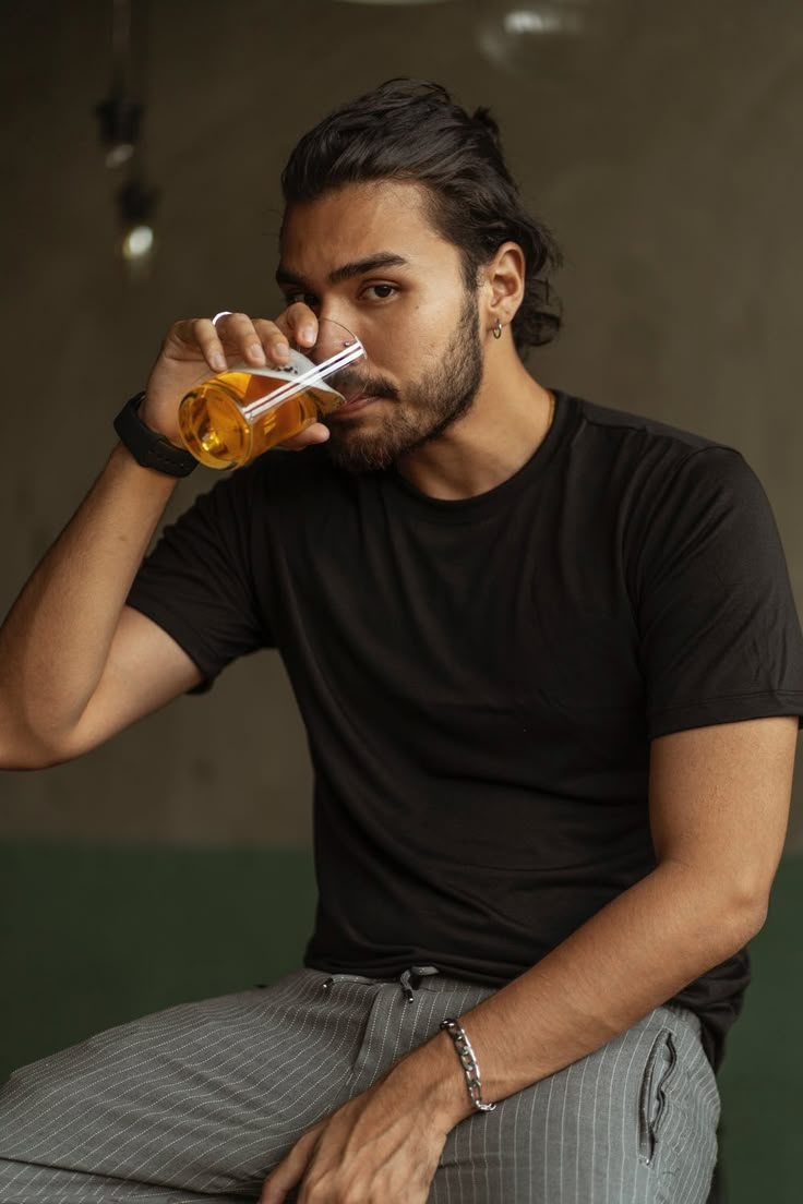 Man in Black Crew Neck T-shirt Drinking Orange Juice · Free Stock Photo Someone Drinking Reference, Drinking Reference Pose, Person Drinking Reference, Drinking Tea Pose Reference, Drinking Drawing Reference, Drinking Pose Reference, Refence Pose, Drinking Coffee Pose, Drinking Poses