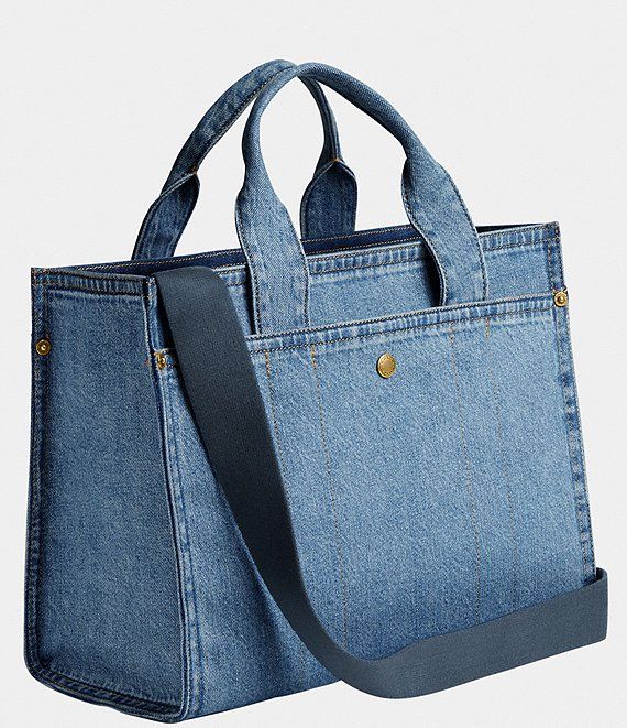 a blue denim bag with gold hardwares on the handles