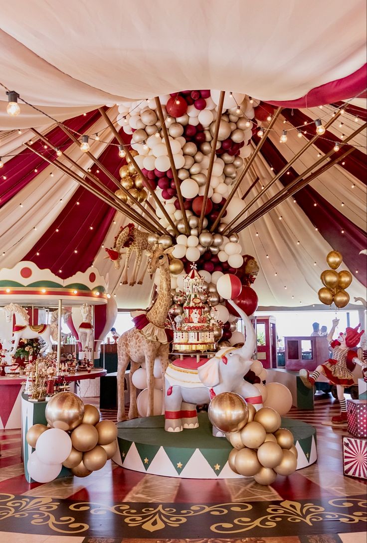 a carousel decorated with balloons and christmas decorations