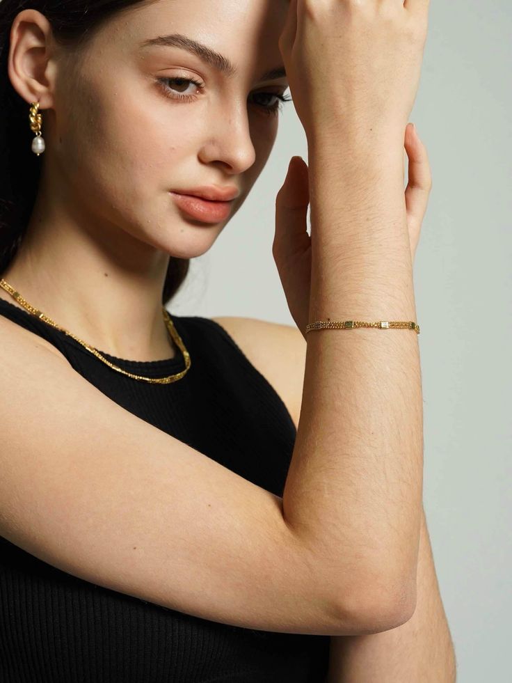 Enhance your bracelet collection with this striking 18K gold-plated layered chain bracelet, featuring rows of meticulously textured beads that offer a luxurious feel. A versatile addition for an effortlessly chic stacked look. Gold Multi-strand Beaded Bracelets For Layering, Tarnish Resistant Chain Bracelet For Layering, Gold Beaded Chain Bracelet In 14k Gold Filled, Gold Beaded Chain Bracelet For Everyday, Elegant Gold Bracelet With Beaded Chain, Dainty Gold Beaded Bracelets With Chain, Elegant Gold Plated Beaded Chain Bracelets, Elegant Gold Plated Beaded Chain Bracelet, Minimalist Yellow Gold Beaded Chain Bracelet