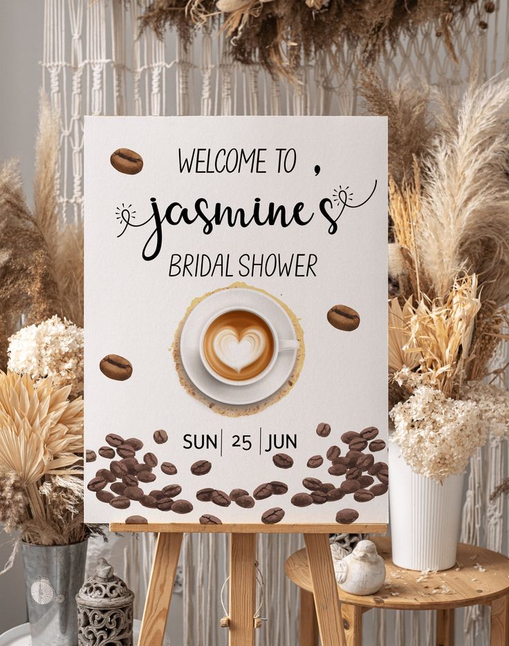 a welcome sign for a bridal shower with coffee beans on it and a heart in the middle