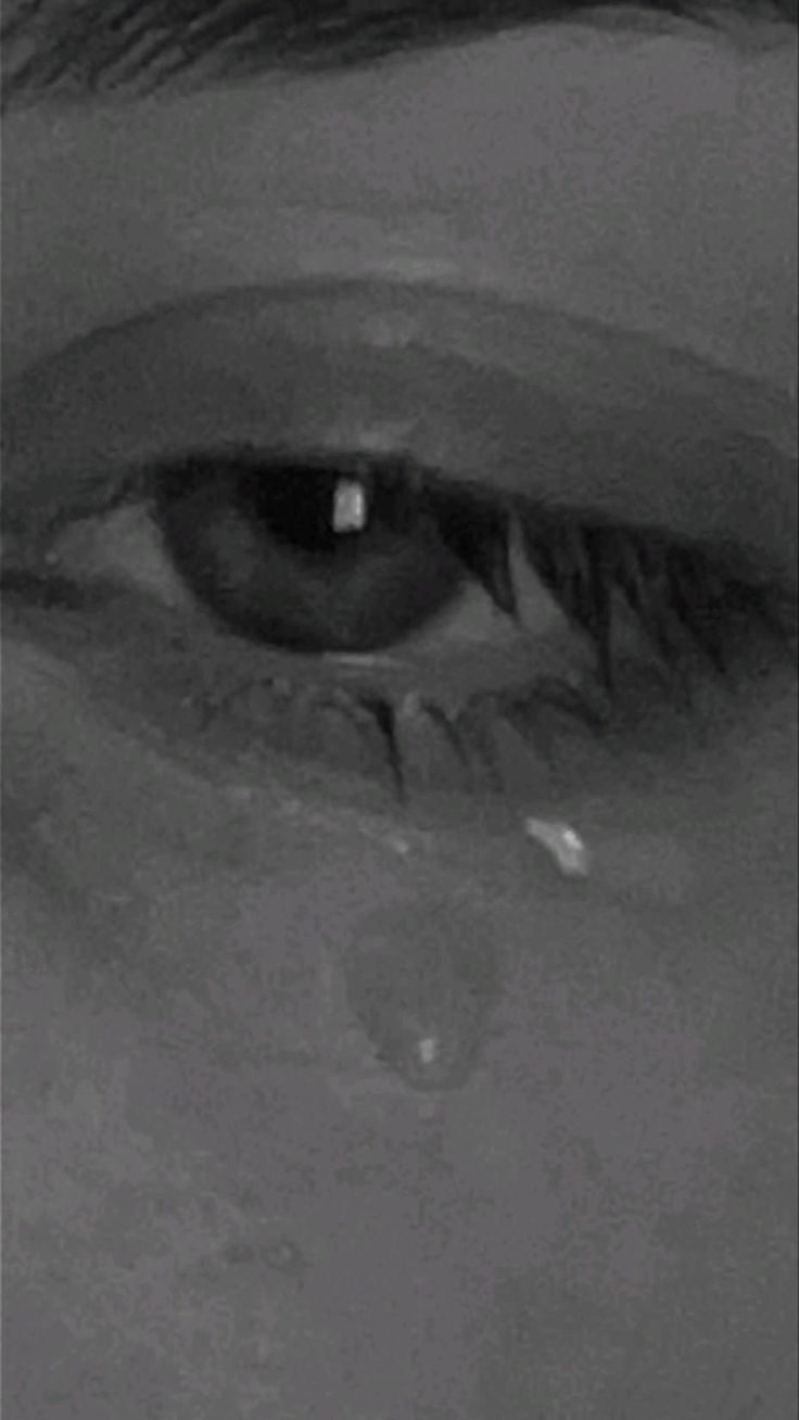 an eye is shown with water droplets coming out of the iris and around it's eyes