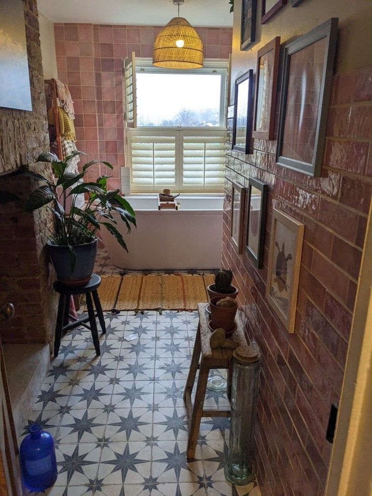 a bathroom with a tiled floor and walls