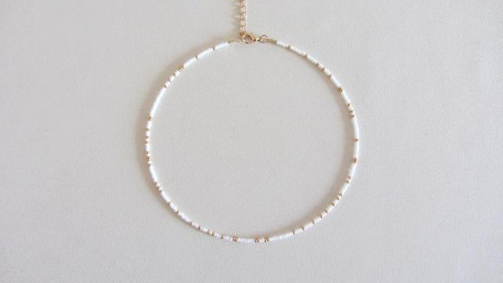 White Minimalist Beaded Bracelets For Summer, Minimalist White Beaded Bracelets For Summer, White Beaded Chain Choker Jewelry, Minimalist White Beaded Necklaces For Beach, Minimalist White Beaded Necklace For The Beach, Minimalist White Beaded Necklace For Beach, Dainty White Beaded Necklace For Festivals, White Round Beads Choker For Beach, Summer Spacer Bead Choker Jewelry