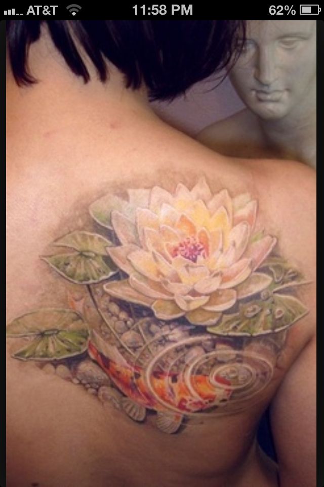 the back of a woman's stomach with an image of a flower on it