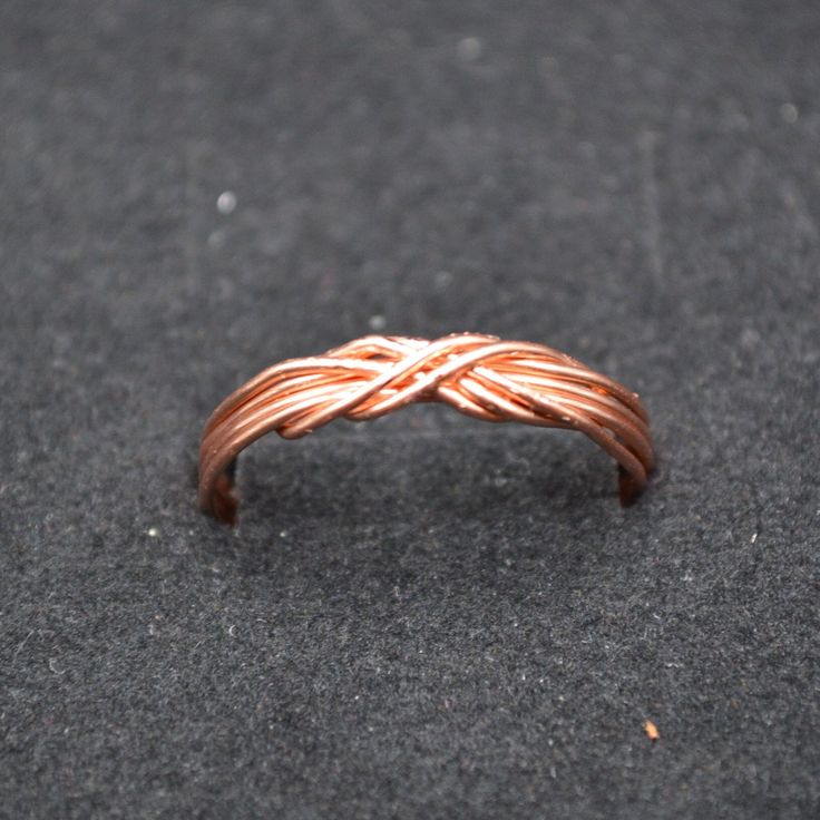 Handmade Solid Copper Infinity Celtic Knot Ring. I use one continuous piece of 20 gauge pure copper wire to create each ring. I make them to order so please include the ring size needed. I love all things celtic and copper is my favorite medium. Celtic knots are the ties that bind. Wear and share them, binding life, love, family and friends together. Wire Wrapped Jewelry Rings, Infinity Knot, Celtic Knot Ring, Ties That Bind, Celtic Knots, Copper Style, Wooden Ring, Knot Ring, Love Family