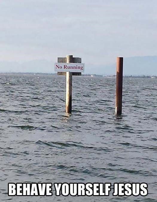 there is a sign in the water that says, behave yourself jesus no running