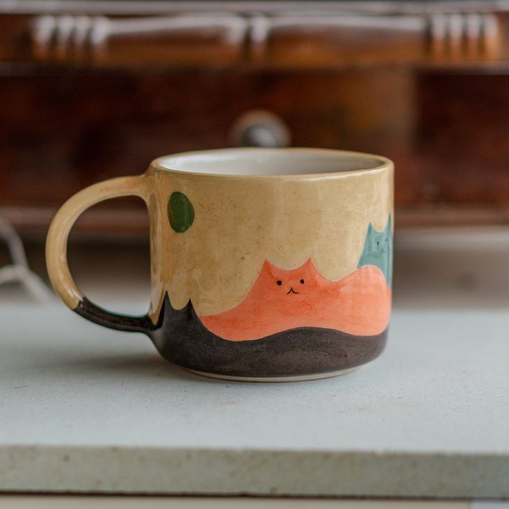 a coffee cup sitting on top of a counter