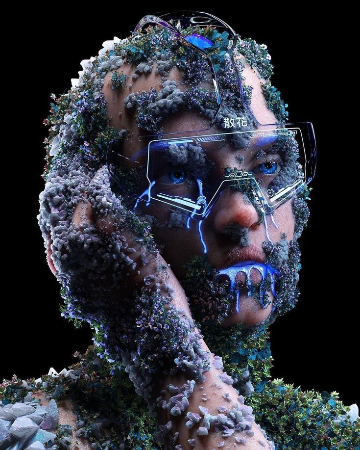 a man with glasses covered in plants and rocks