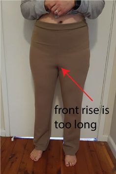 the bottom half of a woman's pants is shown with an arrow pointing to her right