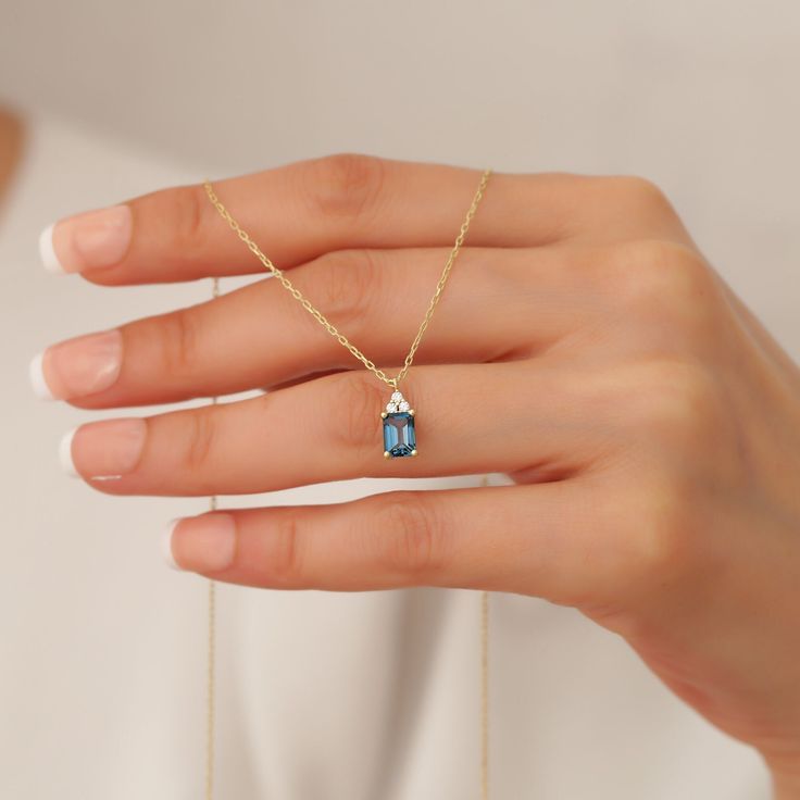 Your 14k Gold Octagon Cut London Blue Topaz Necklace is stylish, dainty and pretty ideal for everyday use. Details of solid gold handmade Blue Topaz Gemstone Pendants are very eye-catching. It is a great gift for your loved ones. This jewelry will be an indispensable piece of yours. This meaningful CZ Octagon Cut Blue Topaz Jewelry with high quality handwork will be a legacy you can leave to your family its.  * London Blue Necklace Details * Material / Gold Kt : This elegant necklace is made of London Blue Topaz Necklace, Blue Topaz Jewelry, Blue Topaz Necklace, Gemstone Pendants, Blue Topaz Pendant, Topaz Jewelry, Topaz Pendant, Topaz Necklace, Rose Gold Pendant