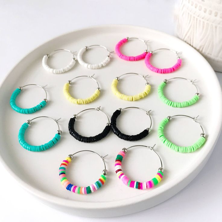 The adorable Harlow vinyl heishi bead hoop earrings are lightweight and comfortable to wear all day.  Add a splash of color to your day with these beaded hoops.  Perfect for Spring, Summer, or ANY time of the year!    Toss on a pair of these cute Harlow hoops with your favorite tee and cut-off denim shorts or dress them up for a night out with the girls!  They're perfect for everyday wear to the office or to school! Details: Harlow: Small partially beaded hoops measure 1 1/4 inches in diameter Diy Jewlry, Earrings Small Hoops, Heishi Beads, Beaded Hoop Earrings, Beaded Hoops, Bead Earrings, Jewelry Earrings Hoops, Time Of The Year, Jewelry Ideas