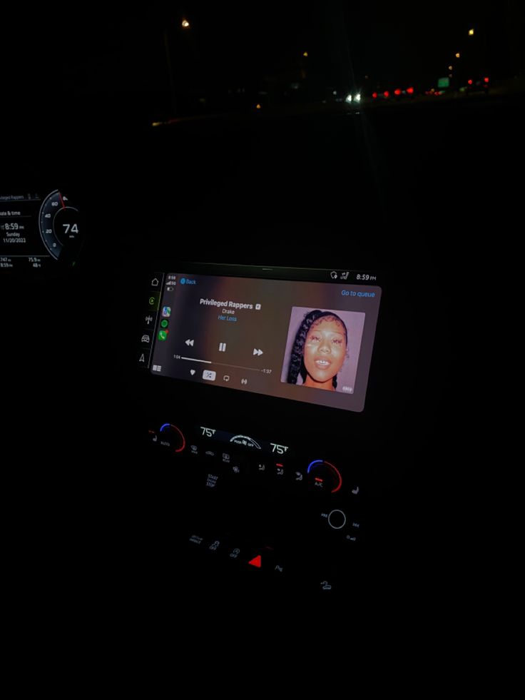 the dashboard of a car with an image of a woman's face on it