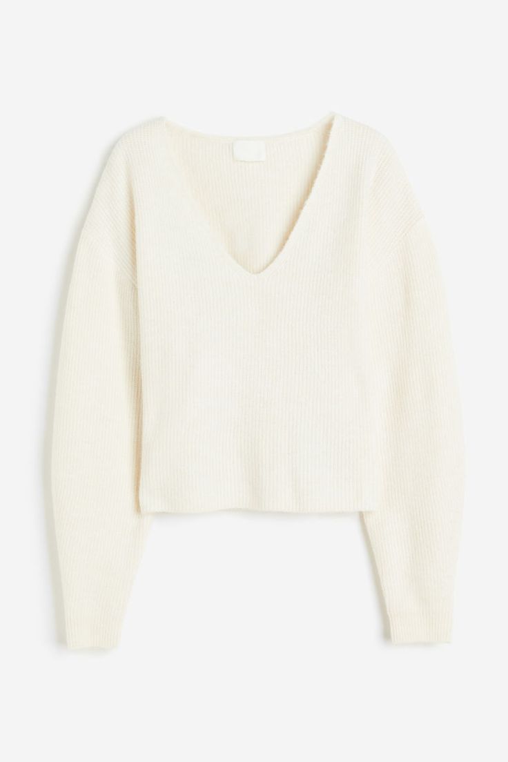 Short  loose-fit sweater in a soft knit. V-neck  dropped shoulders  and long balloon sleeves. Ribbing at neckline and cuffs. Loose Fit Sweater, Cream Sweater, Ribbed Knit Sweater, Dream Clothes, White Sweaters, V Neck Sweater, Soft Knits, Vneck Sweater, Black Sweaters