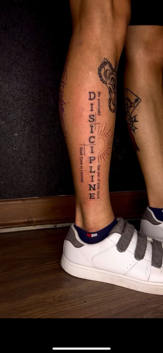 a person with some tattoos on their legs and one leg is showing the word diffrent