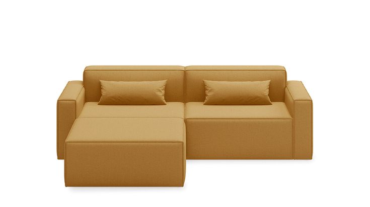 an image of a couch and ottoman with pillows on the bottom half, side view