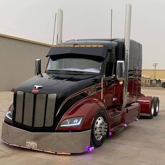 a large semi truck parked in a parking lot