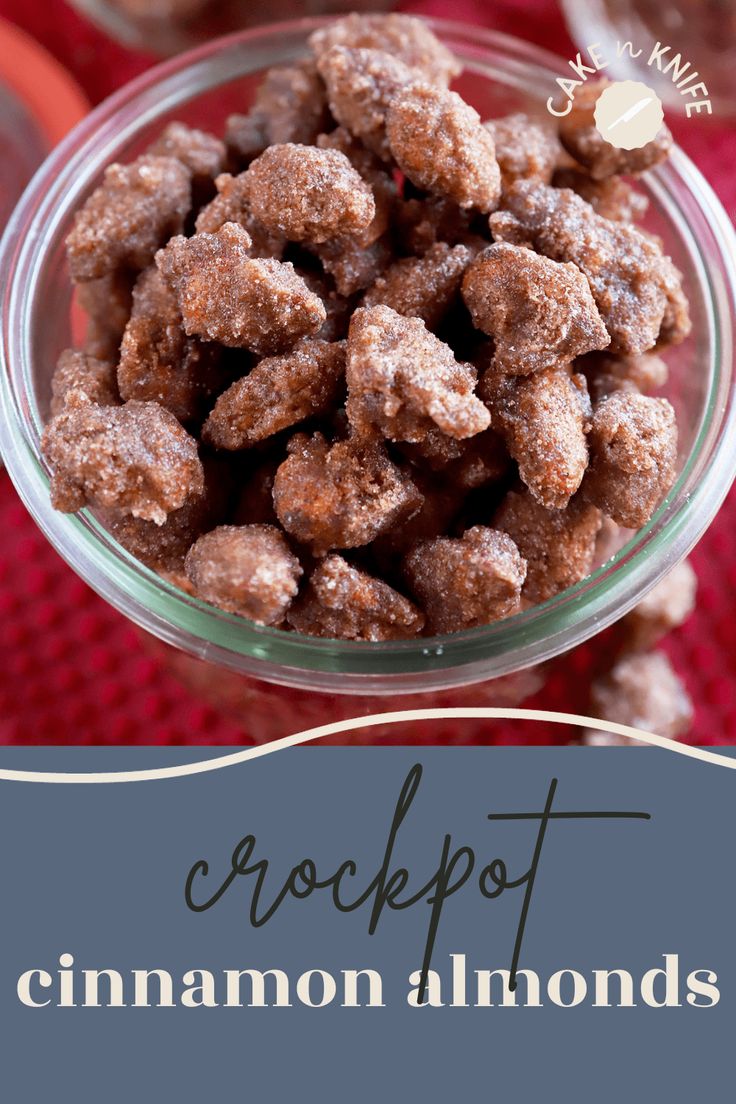 a bowl filled with crockpot cinnamon almonds on top of a red cloth