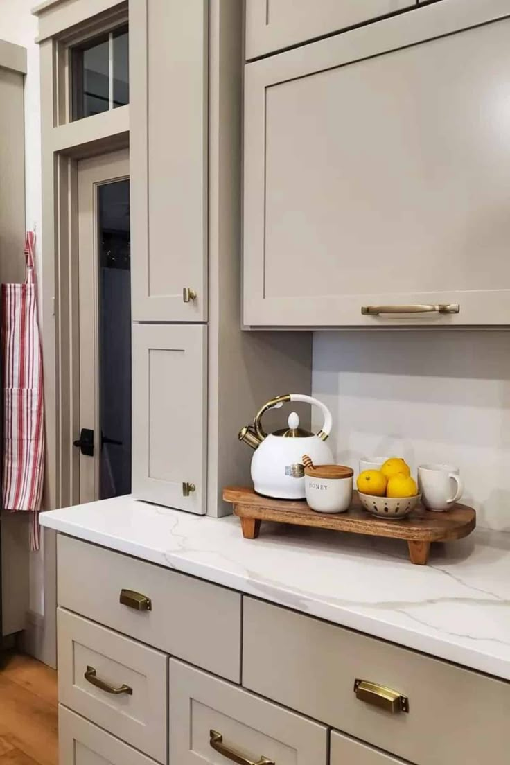 the kitchen counter is clean and ready to be used as a serving tray for lemons