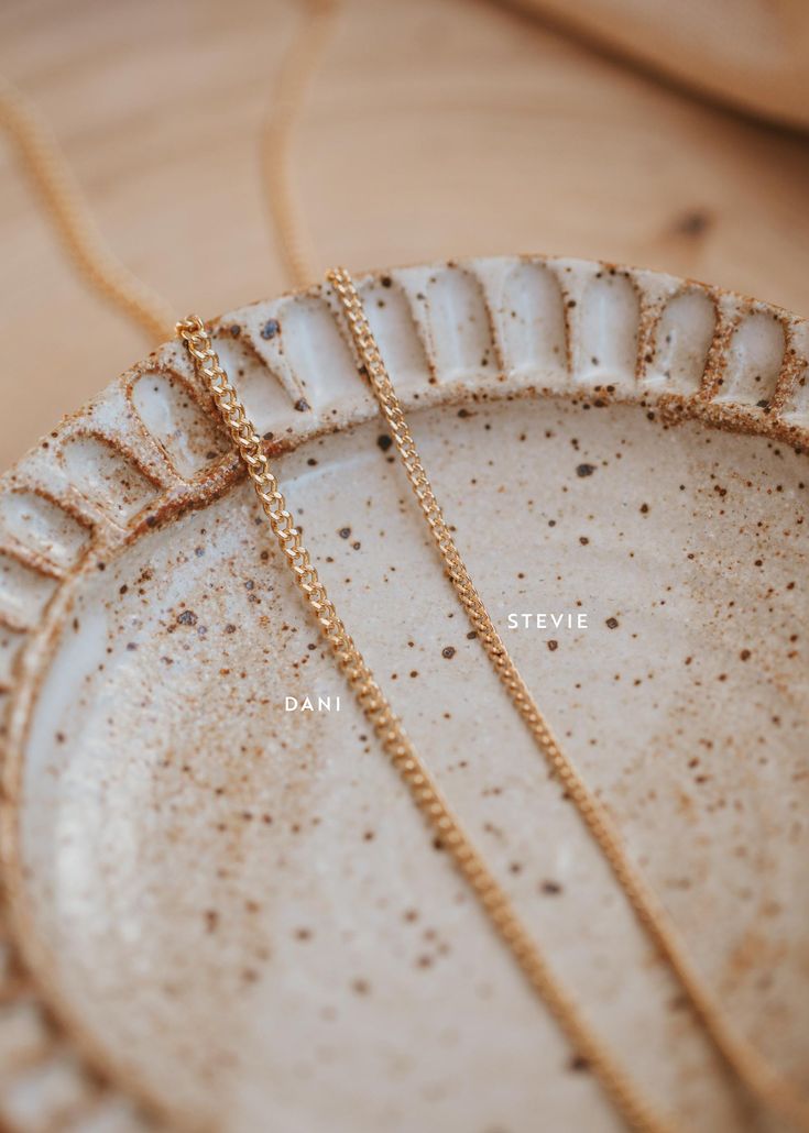 Our Stevie bracelet is like the Goldilocks of our curb chains, not too delicate, not too bold – it’s just right. Bracelet is adjustable from 6.5 - 7". Available in 14kt Gold Fill + Sterling Silver. Claire pairs it with our Maeve Bracelet and Mari Bracelet. Kayla pairs it with our Finn Bracelet. Stacked with our Lace Bracelet, Lenny Bracelet, Satellite Bracelet and Confetti Bracelet. Handmade in Eau Claire, WI. Our jewelry is handmade so each piece will be unique and may vary slightly from what i Adjustable Gold Curb Chain Jewelry, Dainty Cuban Link Curb Chain Jewelry, Everyday Jewelry With Adjustable Cuban Link Chain, Adjustable Dainty Jewelry With Rolo Chain, Dainty Adjustable Jewelry With Rolo Chain, Dainty Adjustable Rolo Chain Jewelry, Dainty Curb Chain Jewelry For Layering, Everyday Cuban Link Jewelry With Adjustable Chain, Delicate 14k Gold Curb Chain Jewelry