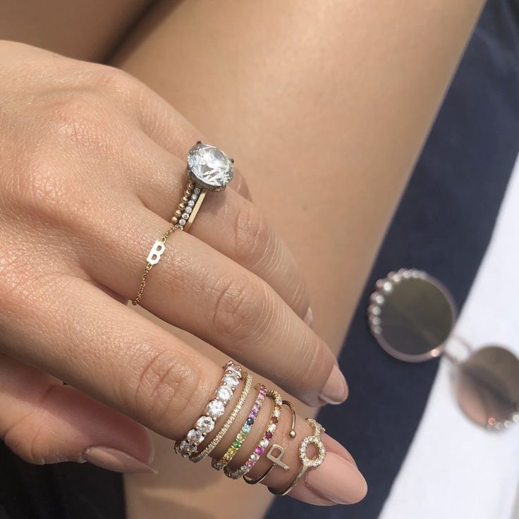 Details: This gorgeous, multicolor Rainbow & Diamond Eternity Band in 14k gold features pavé set color stones alternating with white diamonds all the way around creating an ombré effect. It is delicate and perfect for stacking with your favorite rings or even as an addition to any wedding ring stack. Shop the look: Honeycomb Band, Mini Mini Letter Chain Ring, and Mini Letter Ring Diamonds: 0.25 carats, G color, VS2 clarity Color Stones: Amethysts, Topaz, Ruby, and Sapphires Width: 1.5mm Availabl Diamond White 14k Gold Eternity Band, Dainty Everyday Diamond Eternity Band, Dainty Diamond Eternity Band For Everyday, Dainty Eternity Band With Diamond Accents, Everyday Dainty Diamond Eternity Band, Everyday Eternity Band With Diamond Accents, Everyday Diamond Stackable Rings With Round Cut, Dainty White Gold Eternity Band With Single Cut Diamonds, Modern Yellow Gold Eternity Band With Diamond Accents