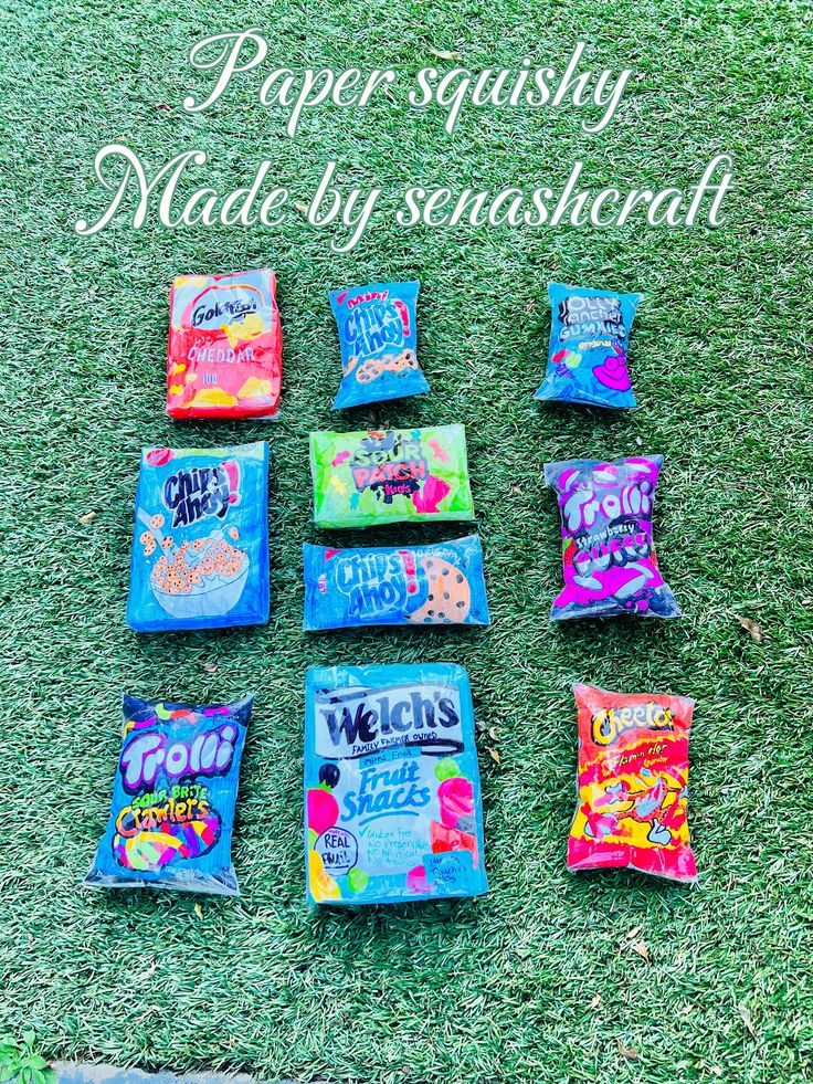 paper squissy snacks laid out on the grass