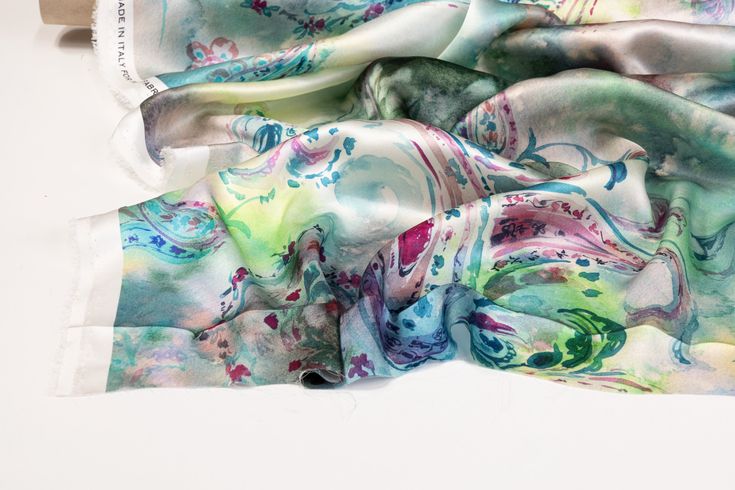 Experience elegance with our luxurious Italian silk charmeuse fabric. Soft and with a light, fluid drape, this fabric is perfect for any special occasion. The unique and vibrant tie-dye print adds a touch of originality, making a statement piece for any wardrobe. Bohemian Satin Silk Scarf For Summer, Elegant Multicolor Silk Scarf For Wedding, Summer Silk Scarf With Satin Finish, Elegant Multicolor Silk Scarf For Party, Multicolor Satin Silk Scarf For Summer, Multicolor Satin Silk Scarf For Spring, Elegant Patterned Silk Scarf With Paisley Print, Summer Multicolor Satin Silk Scarf, Silk Scarf For Spring Party