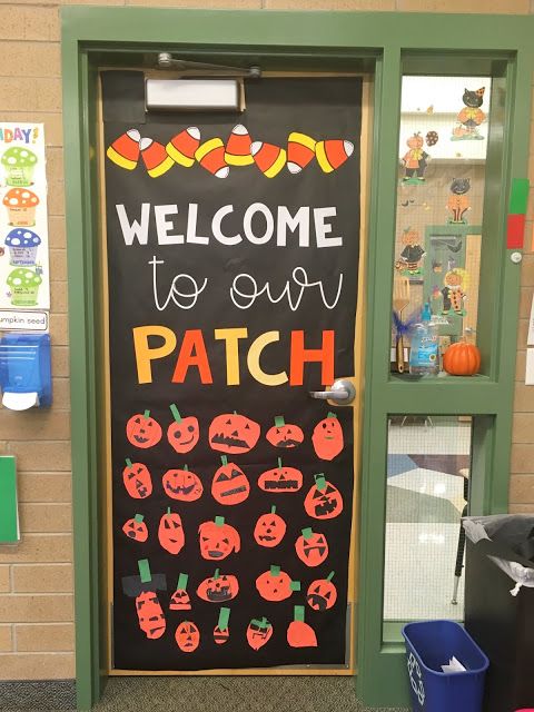 a classroom door decorated with pumpkins and welcome to our patch