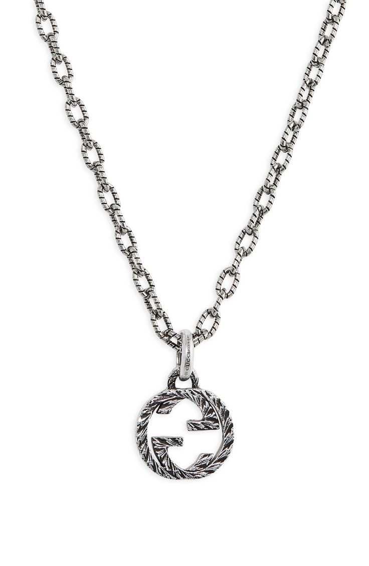 This chain necklace makes a recognizable statement with an interlocking-G logo pendant that's cast in sterling silver and engraved for added dimension. Style Name:Gucci Interlocking G Pendant Necklace. Style Number: 6246714. Luxury Engraved Gucci Necklaces, Designer Silver Jewelry With Logo Charm, Luxury Silver Jewelry With Logo Charm, Engraved Silver Gucci Necklace, Luxury Silver Chain Necklace With Logo Charm, Luxury Gucci Silver Chain Jewelry, Designer Pendant Chain Jewelry, Gucci Sterling Silver Chain Jewelry, Gucci Sterling Silver Jewelry