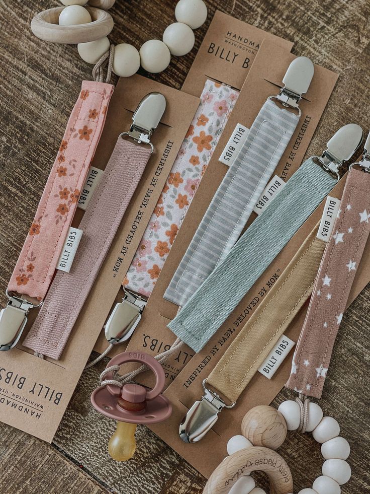 several different types of baby pacifier clips