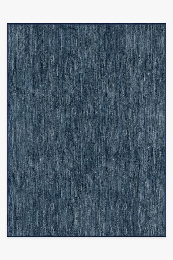 an area rug with dark blue colors