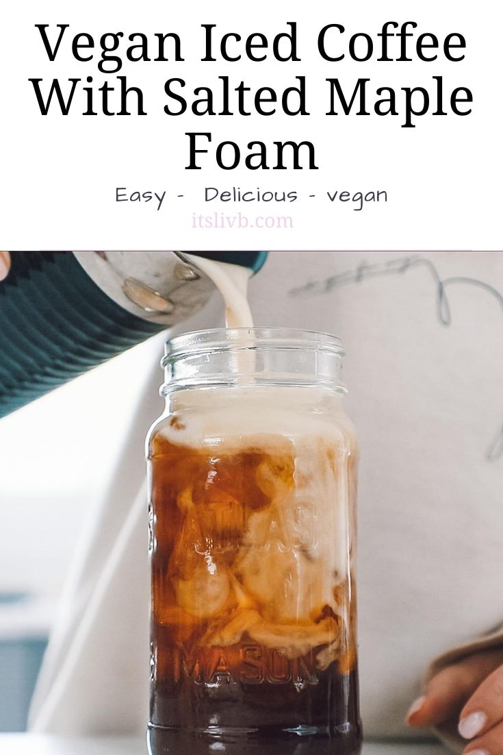 a person pouring iced coffee into a mason jar with text overlay that reads, vegan iced coffee with salted maple foam