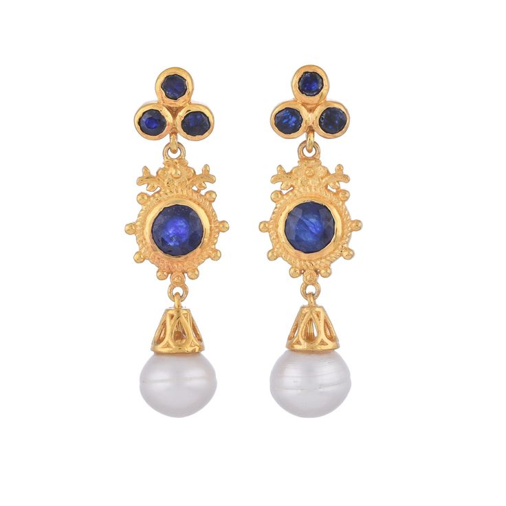 Blue Sapphire & Pearl Vermeil 14K Gold Over Sterling Silver Earring 925 Silver = 5.60 gm. Blue Sapphire & Pearl= 7.00 ct. Blue Sapphire is the birthstone for September and is a symbol of heaven. Pearl is the birthstone for June and is a symbol of good fortune and strength. The beautiful earring measures to be 1.90 inches long and 0.50 inches wide at its maximum points. The earrings have been made by a team of highly trained and skilled artisans. What is Vermeil 14K Gold? It is a thick layer of 1 Blue Pearl Earrings For Anniversary Fine Jewelry, Blue Round Pearl Earrings For Anniversary, Blue Pearl Earrings For Anniversary, Blue Round Clip-on Jewelry, Classic Blue Round Pearl Earrings, Fine Jewelry Blue Pearl Drop Earrings, Classic Blue Pearl Earrings For Anniversary, Sapphire Earrings With Multiple Jewels, Blue Pearl Drop Earrings Fine Jewelry