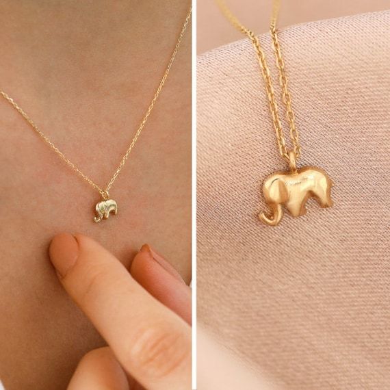 "Introducing the 14k Gold Elephant Necklace, a beautiful and timeless piece of jewelry that showcases the grace and strength of one of nature's most magnificent creatures. Made of high-quality 14k gold, this necklace is both durable and stylish, making it a perfect addition to any jewelry collection. The intricate design features a detailed elephant pendant that is sure to catch the eye and spark conversations. The elephant is a symbol of good luck, strength, and wisdom, making this necklace not Tarnish Resistant Recycled Gold Charm Necklaces As Gift, Tarnish Resistant Recycled Gold Charm Necklace As Gift, Dainty Pendant Jewelry For Birthday, Minimalist Jewelry For Birthday And Mother's Day, Gift Charm Necklaces With Delicate Chain In Recycled Gold, Recycled Gold Charm Necklace With Delicate Chain For Gift, Dainty Nickel-free Jewelry For Birthday Gift, Gift Charm Necklace With Delicate Chain In Recycled Gold, Sterling Silver Necklace For Gift