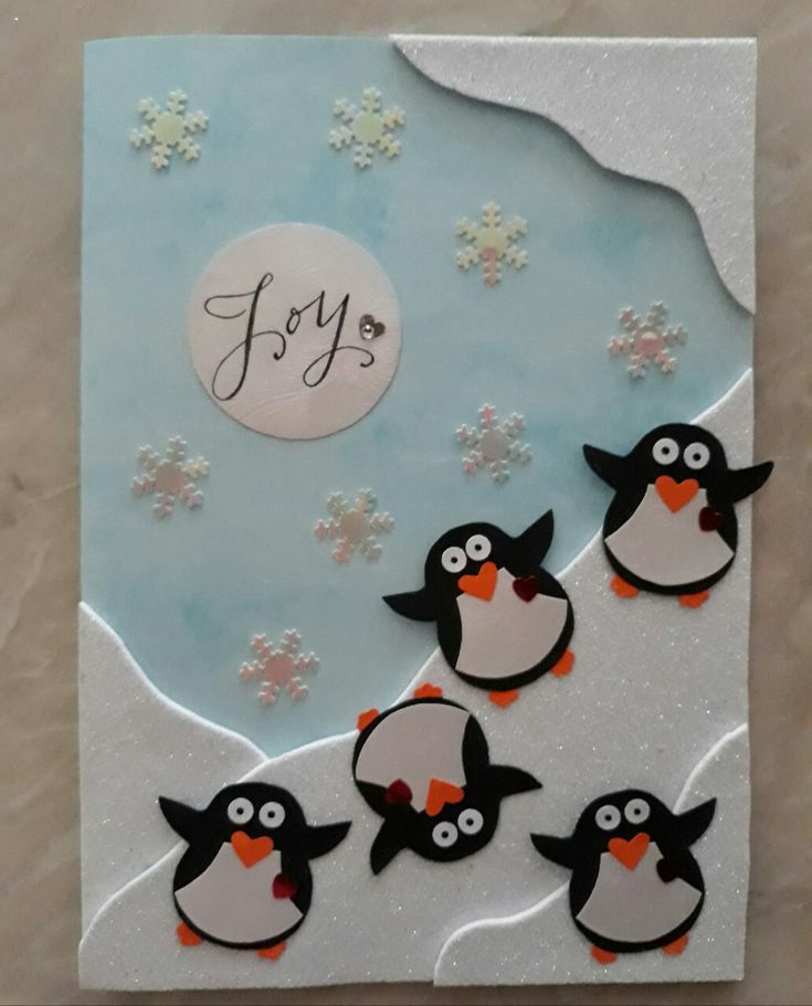 a card with penguins and snowflakes on it