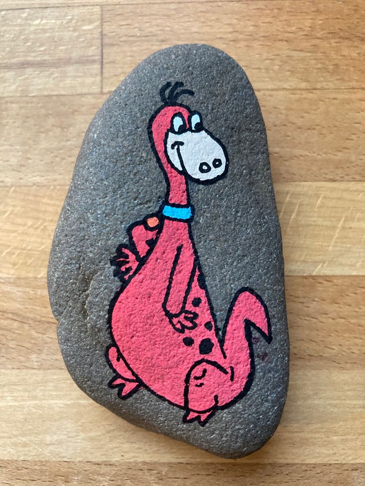 a rock with a cartoon character painted on it