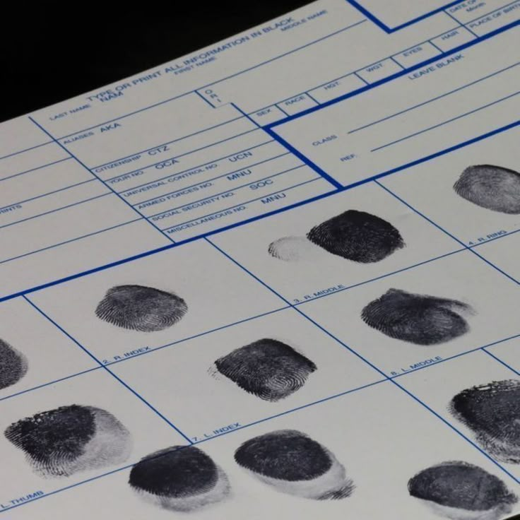 several fingerprints are displayed on a table