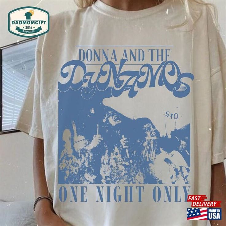 a woman wearing a t - shirt that says donna and the dawgs one night only