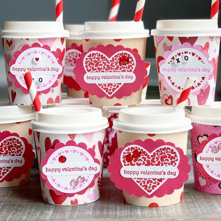 valentine's day ice cream cups with straws in them