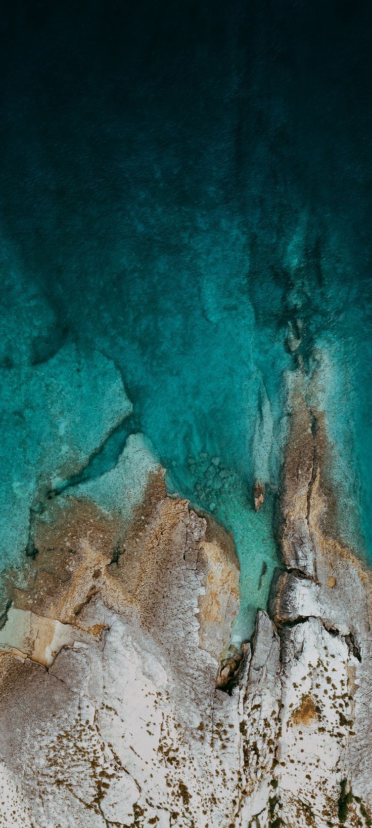 an aerial view of the water and land